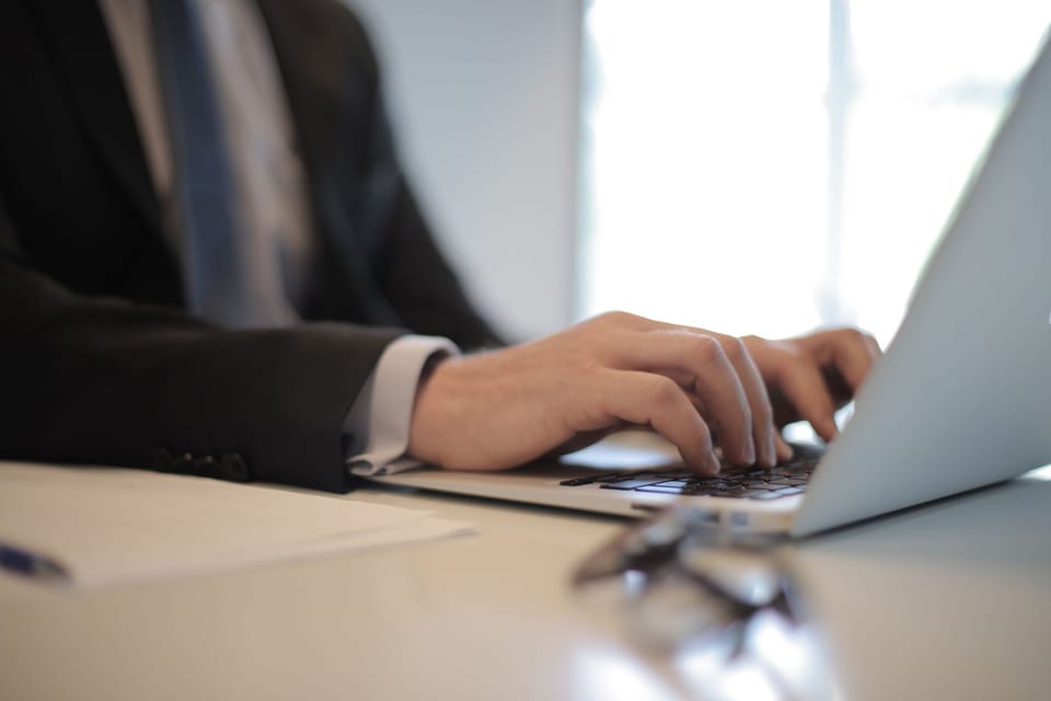 Writing an email at a desk