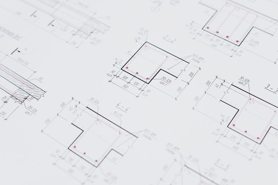 Building plans spread across a table