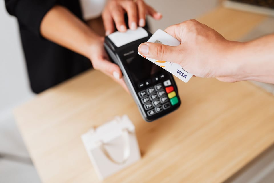 A card being tapped on a payment reader